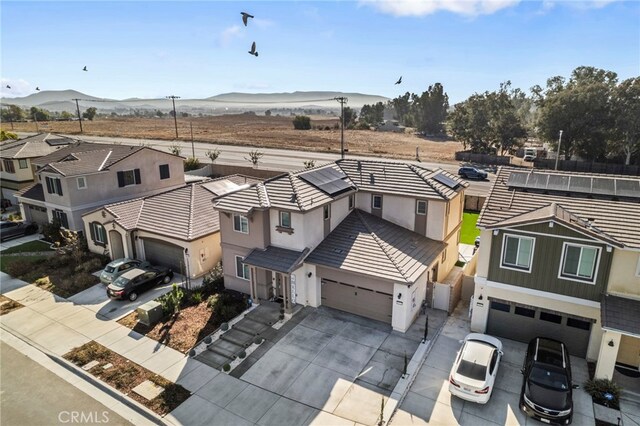 birds eye view of property with a mountain view