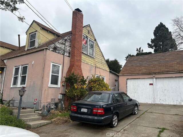 view of side of property with a garage