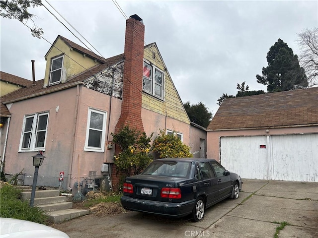 view of side of home with a garage