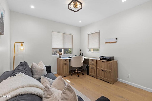 office space with light hardwood / wood-style floors