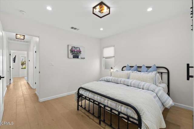 bedroom featuring light hardwood / wood-style floors