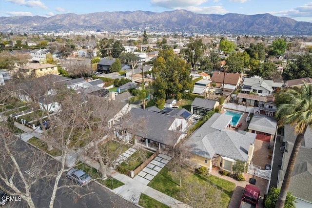 birds eye view of property featuring a mountain view