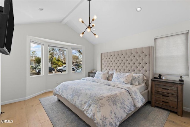 bedroom featuring lofted ceiling with beams, light hardwood / wood-style flooring, and a notable chandelier