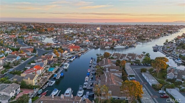 aerial view at dusk with a water view