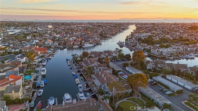 aerial view at dusk with a water view