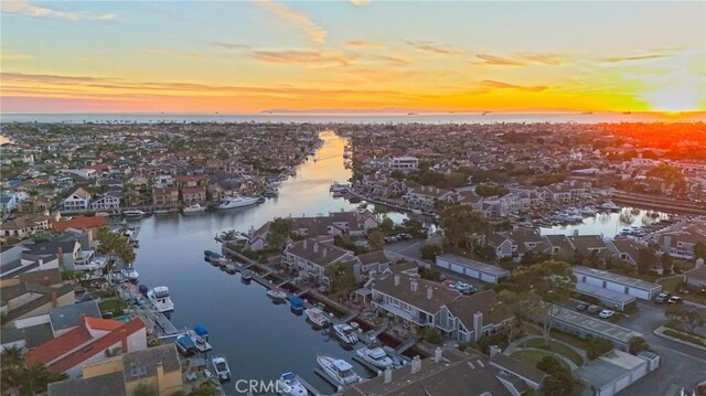 aerial view at dusk with a water view