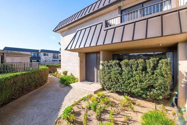 property entrance with a balcony