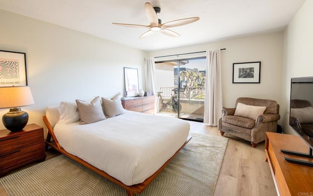 bedroom featuring ceiling fan, access to exterior, and light hardwood / wood-style flooring