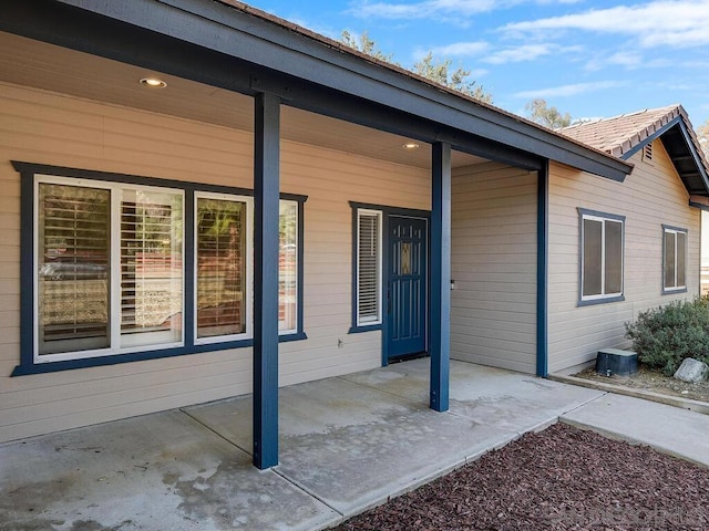 doorway to property featuring a patio area