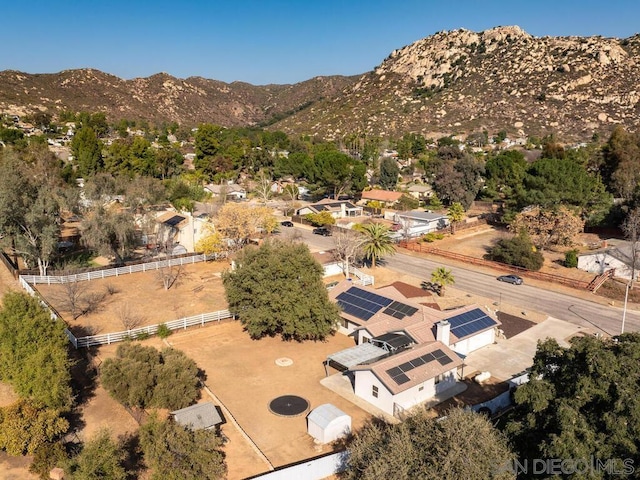 birds eye view of property with a mountain view