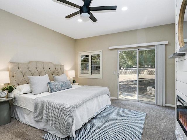 bedroom with ceiling fan, carpet flooring, and access to exterior