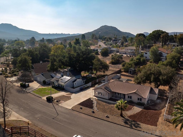 birds eye view of property with a mountain view