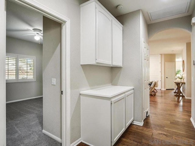 corridor featuring dark hardwood / wood-style flooring