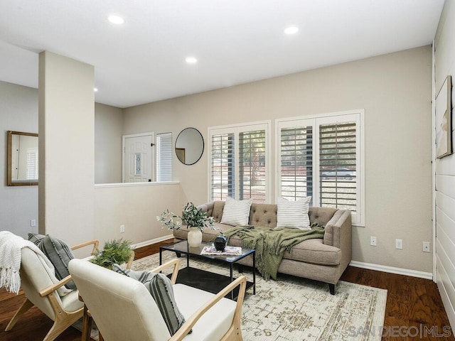 living room with dark hardwood / wood-style flooring