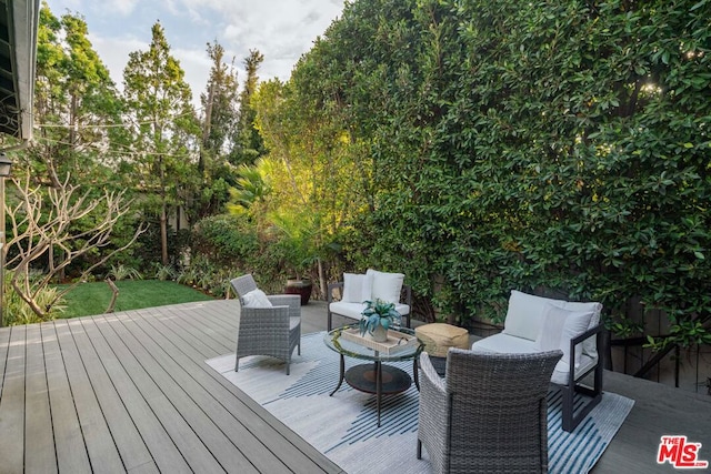 wooden deck featuring an outdoor living space