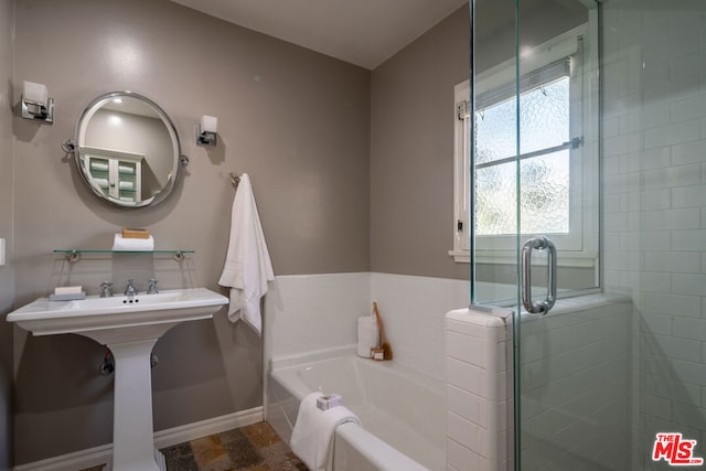 bathroom featuring plus walk in shower