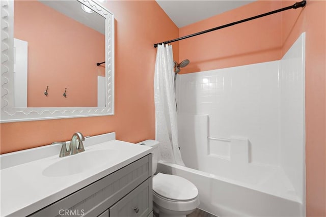 full bathroom with vanity, shower / bath combination with curtain, and toilet