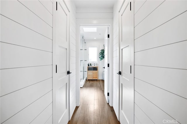 corridor with dark wood-type flooring