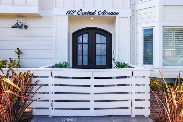 property entrance featuring french doors