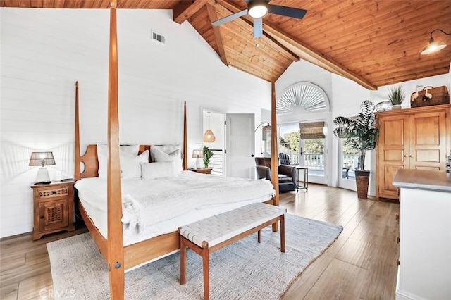 bedroom with high vaulted ceiling, light hardwood / wood-style flooring, wooden ceiling, and beamed ceiling