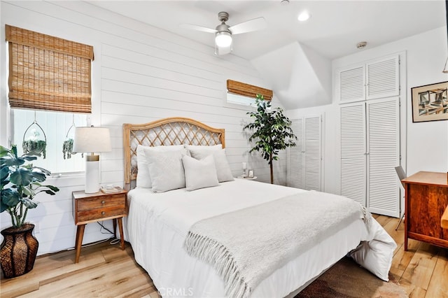 bedroom with ceiling fan and light wood-type flooring