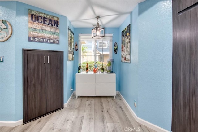 doorway with light hardwood / wood-style floors