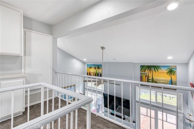 hallway with carpet floors