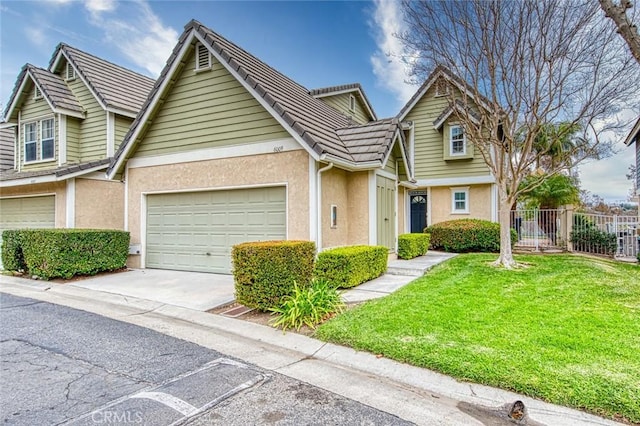 view of front of house featuring a garage and a front yard