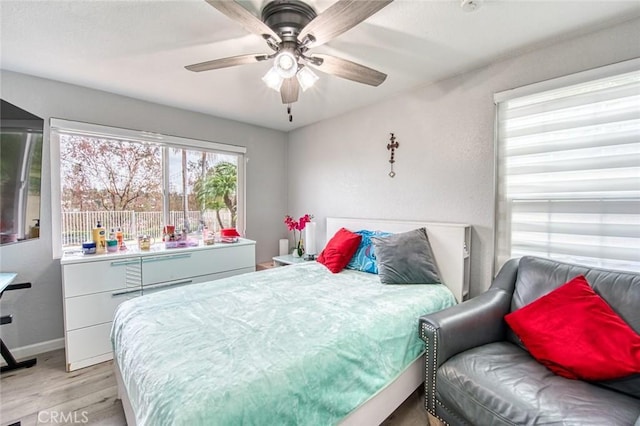 bedroom featuring light hardwood / wood-style flooring and ceiling fan