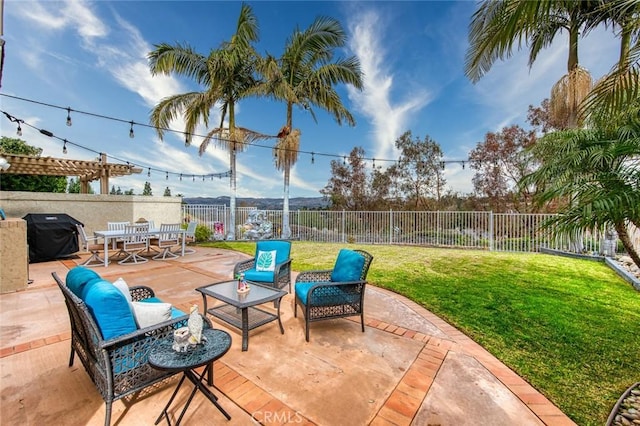 view of patio with area for grilling and an outdoor living space