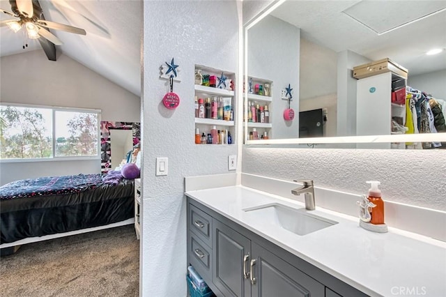 bathroom with vanity, vaulted ceiling with beams, and ceiling fan