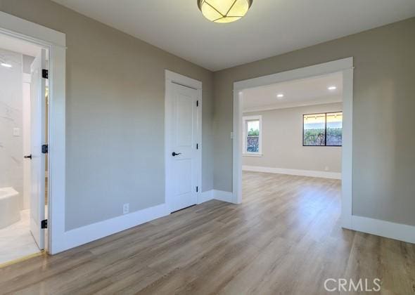 spare room with light wood-type flooring