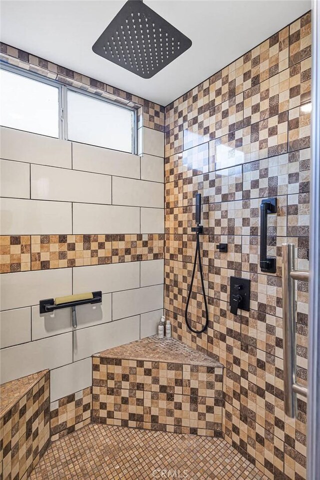 interior space with tiled shower