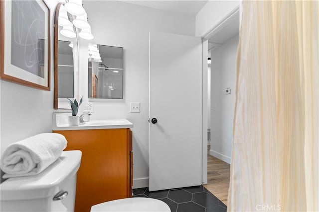 bathroom with vanity and toilet