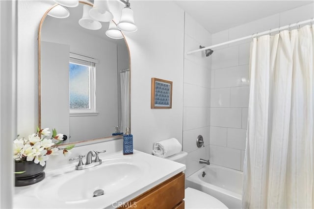 full bathroom featuring vanity, toilet, and shower / tub combo with curtain