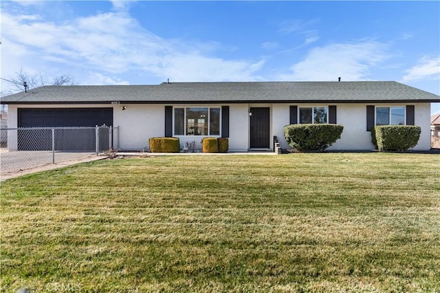 ranch-style home with a garage and a front yard