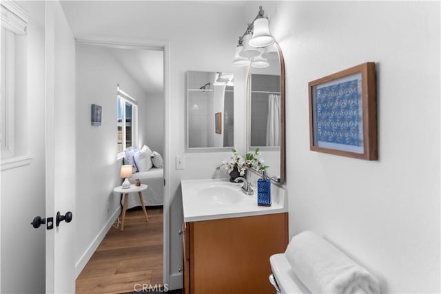 bathroom featuring vanity, hardwood / wood-style floors, and a shower with shower curtain