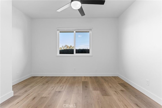 empty room featuring ceiling fan and light wood-type flooring