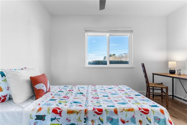 bedroom featuring hardwood / wood-style flooring and ceiling fan