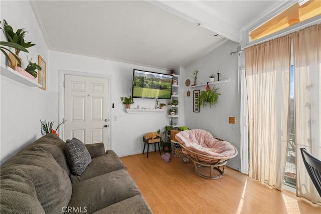 living room with hardwood / wood-style flooring, crown molding, and lofted ceiling with beams