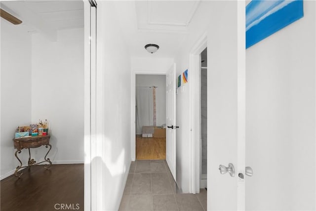 corridor featuring light tile patterned flooring