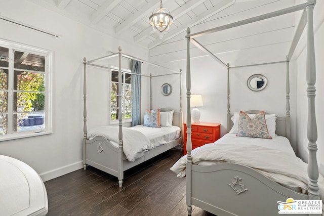 bedroom with lofted ceiling with beams, dark hardwood / wood-style floors, and wooden ceiling