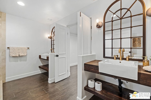 bathroom featuring hardwood / wood-style floors and sink