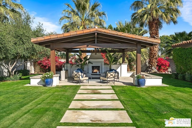 exterior space featuring a gazebo and an outdoor fireplace