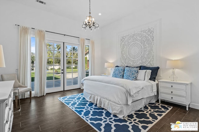 bedroom featuring french doors, dark hardwood / wood-style flooring, a chandelier, and access to outside