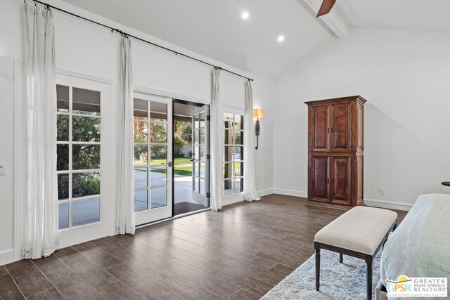 unfurnished room with beamed ceiling, dark hardwood / wood-style floors, and high vaulted ceiling