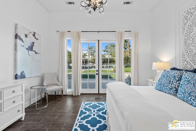 bedroom featuring a notable chandelier, access to outside, and french doors