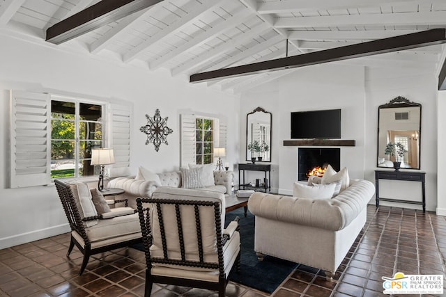 living room with beam ceiling, high vaulted ceiling, and dark tile patterned floors