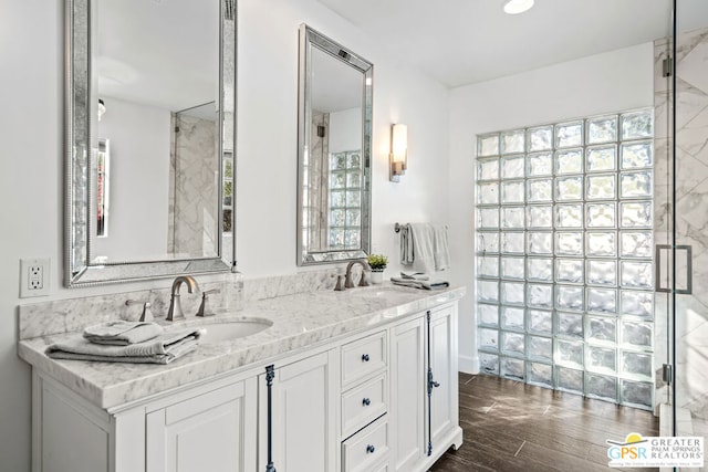 bathroom featuring vanity and hardwood / wood-style floors