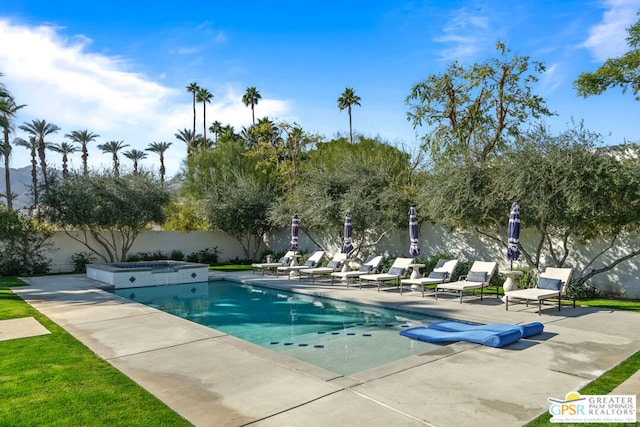 view of swimming pool featuring a patio